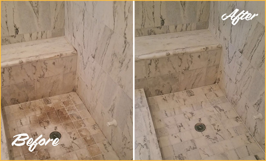 Before and After Picture of a Green Hills Marble Shower Honed to Remove Dark Stains